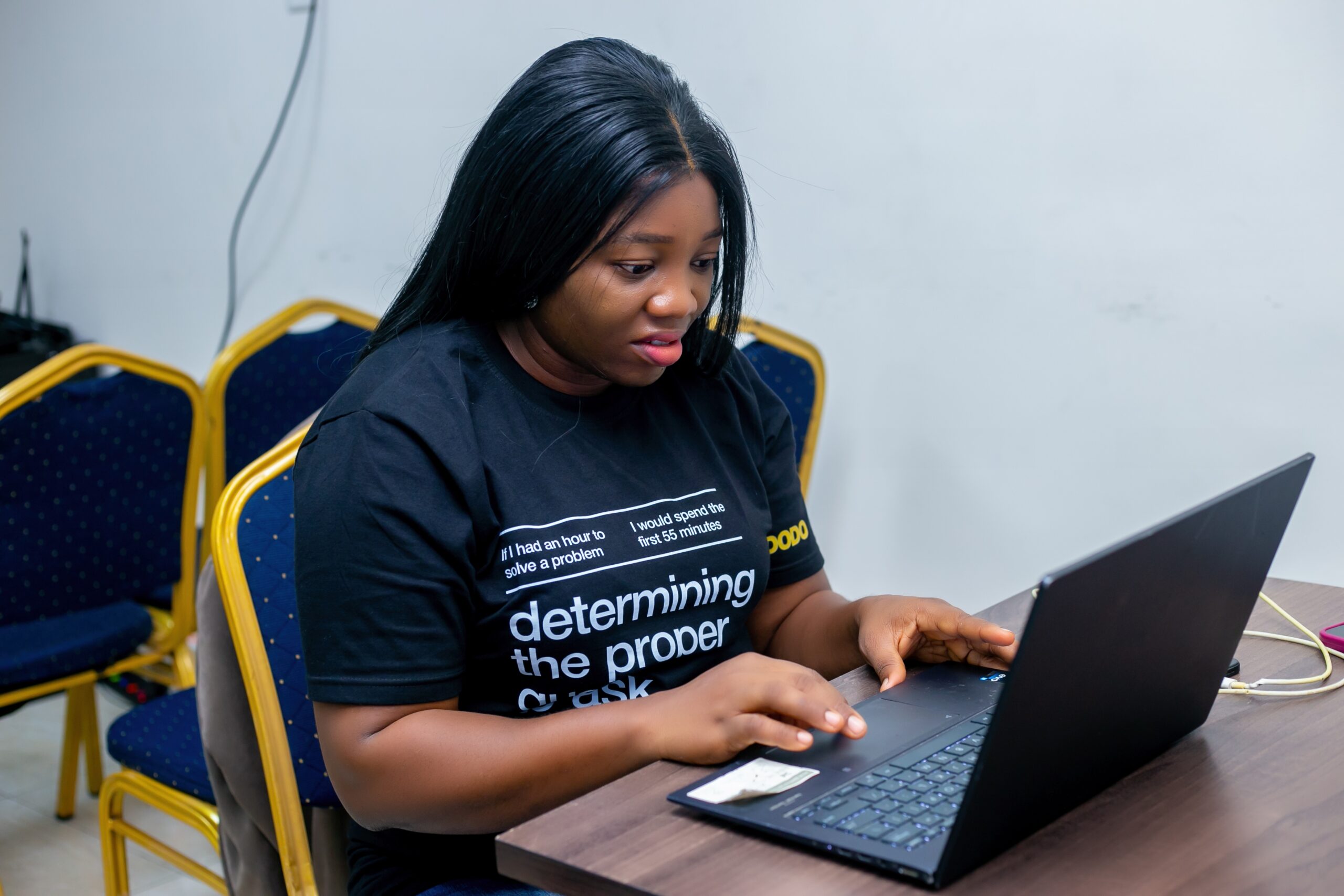 Omowunmi analyzing data during her user research fieldwork.